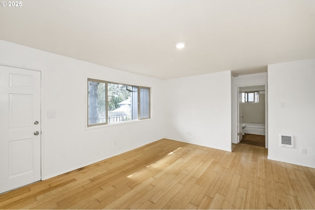 spare room with visible vents and light wood-style floors