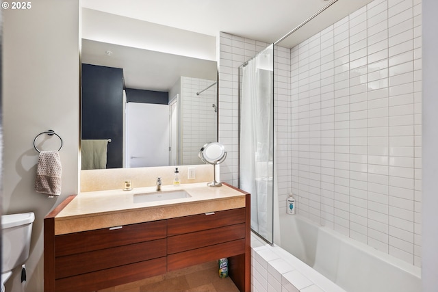 full bath with vanity, tile patterned floors, toilet, and tiled shower / bath combo