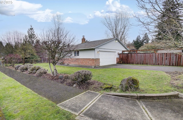 view of home's exterior with a lawn and a garage