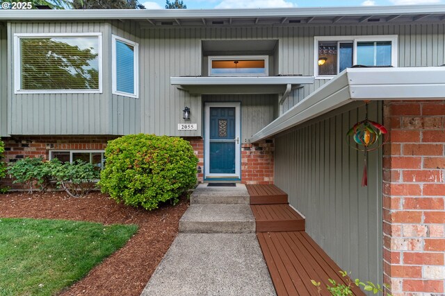 property entrance with brick siding