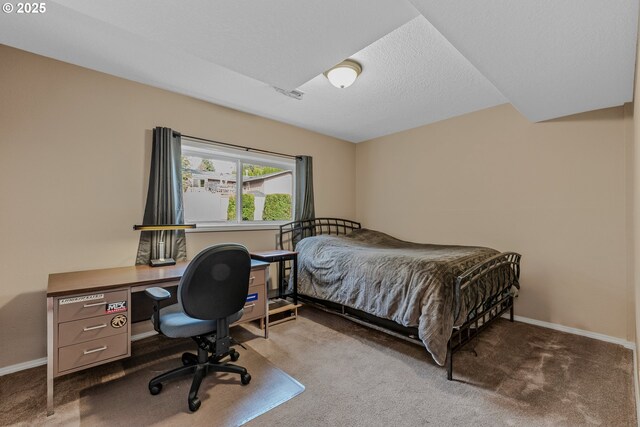 bedroom with carpet floors and baseboards