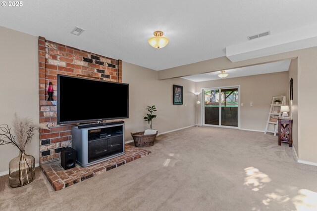 living room featuring carpet flooring and baseboards
