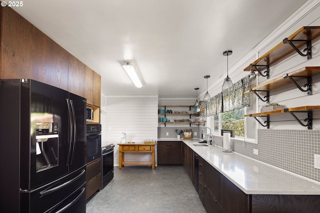 kitchen featuring modern cabinets, open shelves, light countertops, a sink, and black appliances