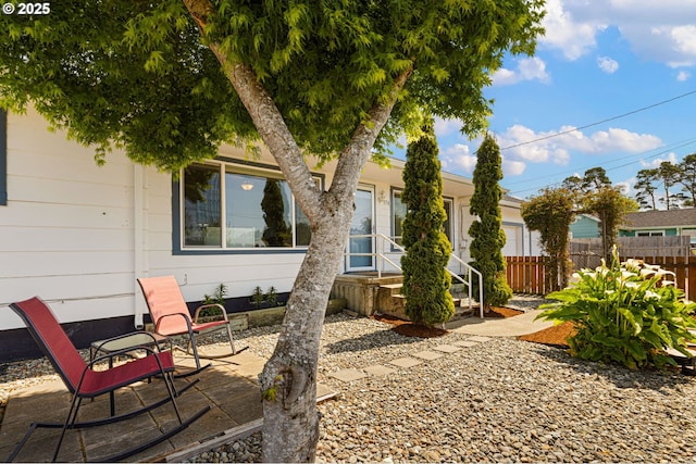 exterior space with fence and a patio area