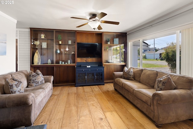 living room featuring light wood-style floors and ceiling fan