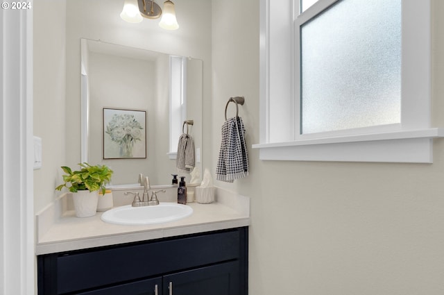 bathroom featuring vanity and a healthy amount of sunlight