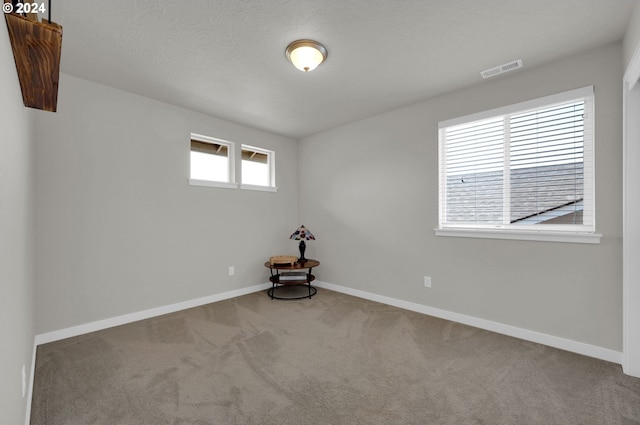 empty room with light colored carpet