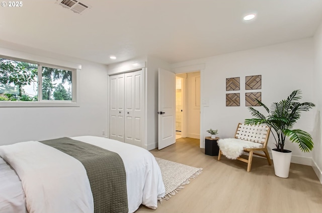 11940 SW Edgewood St, Portland, OR 97225 - bedroom with light wood finished floors, baseboards, a closet, and recessed lighting