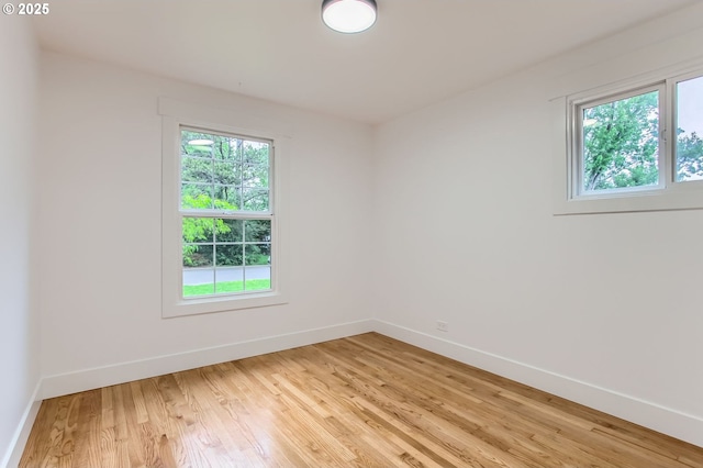 11940 SW Edgewood St, Portland, OR 97225 - unfurnished room featuring plenty of natural light, baseboards, and light wood finished floors