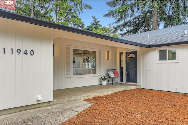 11940 SW Edgewood St, Portland, OR 97225 - property entrance featuring roof with shingles and covered porch