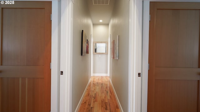 hall with light wood-type flooring