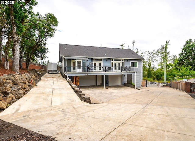 back of house with a garage