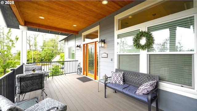 wooden terrace featuring an outdoor hangout area