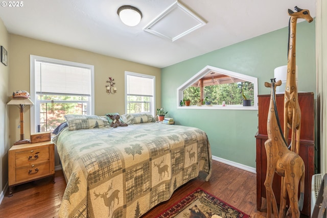 1274 Wild Mustang Ln, Gilchrist, OR 97737 - bedroom with attic access, wood finished floors, and baseboards