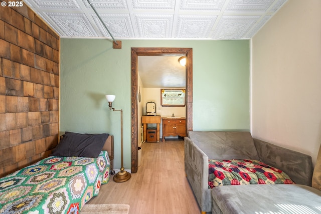 1274 Wild Mustang Ln, Gilchrist, OR 97737 - bedroom with wood finished floors, a sink, and an ornate ceiling