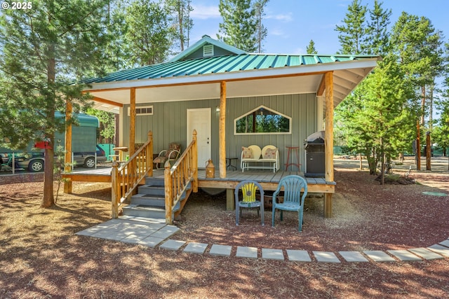 1274 Wild Mustang Ln, Gilchrist, OR 97737 - view of front of property with metal roof and covered porch