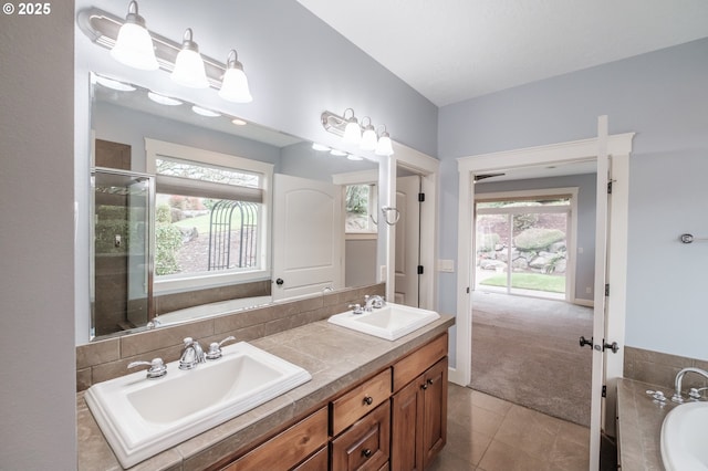 bathroom featuring tile patterned flooring, vanity, and plus walk in shower