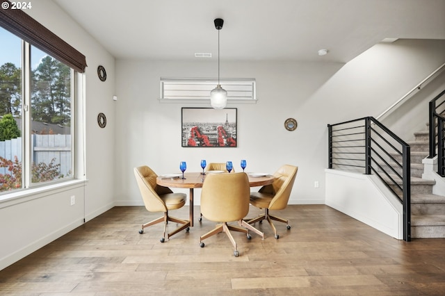 dining space with light hardwood / wood-style floors