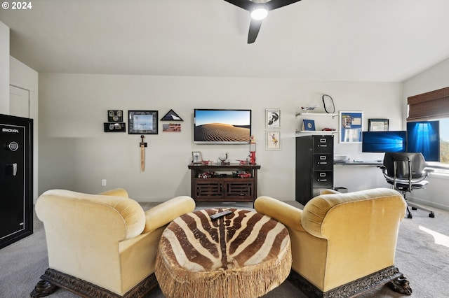 living room with ceiling fan and carpet