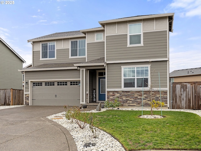 view of front facade with a garage and a front yard