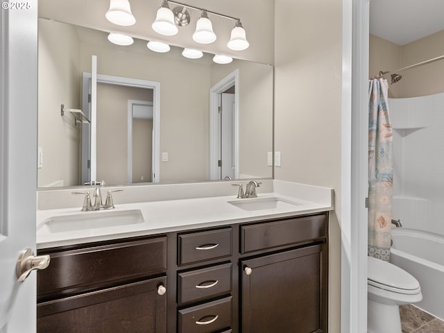 full bathroom with vanity, toilet, and shower / bath combo with shower curtain