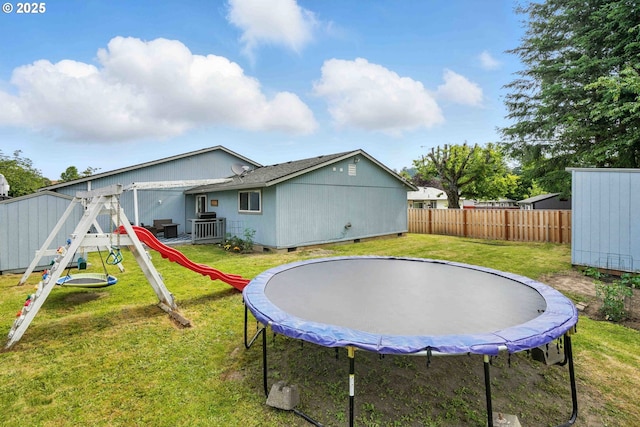 1208 SE Chapman Ave, Troutdale, OR 97060 - back of property featuring a trampoline, a playground, and a storage shed