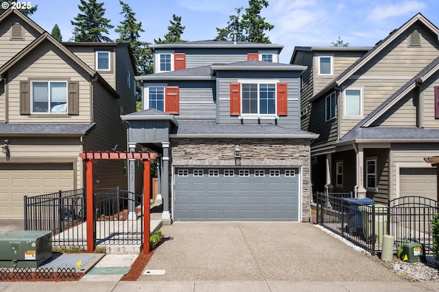 20937 SW Edgemont St, Beaverton, OR 97003 - view of property with a garage, stone siding, driveway, and roof with shingles