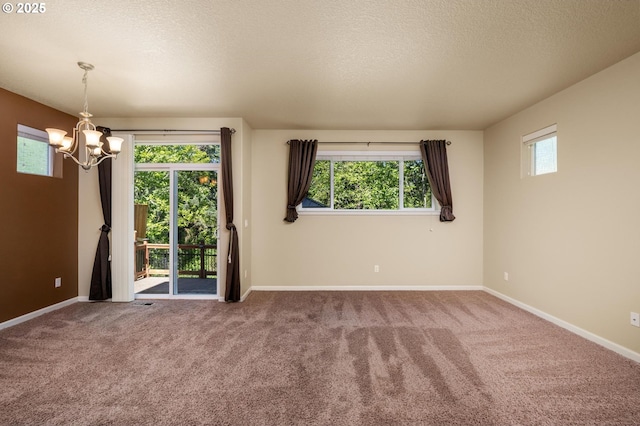 20937 SW Edgemont St, Beaverton, OR 97003 - empty room featuring a chandelier, baseboards, carpet flooring, and a textured ceiling
