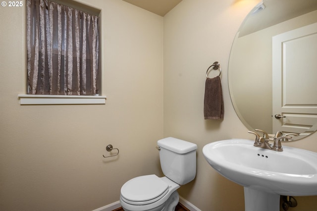 20937 SW Edgemont St, Beaverton, OR 97003 - half bathroom with baseboards, toilet, and a sink