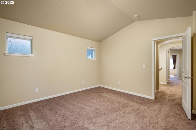 20937 SW Edgemont St, Beaverton, OR 97003 - carpeted spare room with lofted ceiling, arched walkways, baseboards, and a smoke detector