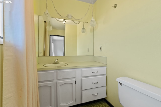 bathroom with toilet and vanity