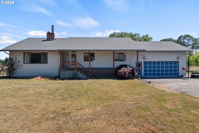 ranch-style house with a garage and a front lawn