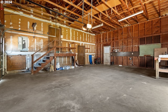 garage featuring a garage door opener and electric panel