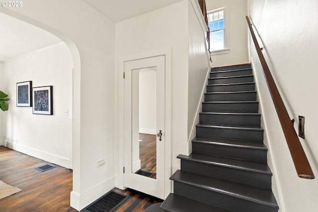 5125 NE Davis St, Portland, OR 97213 - staircase with wood finished floors, arched walkways, and baseboards