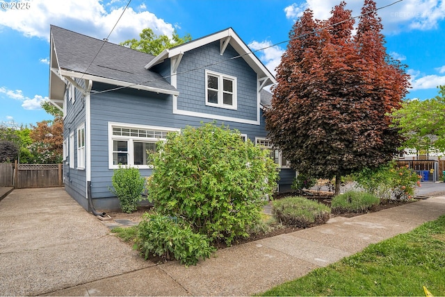 5125 NE Davis St, Portland, OR 97213 - view of property exterior with fence and roof with shingles