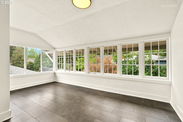 5125 NE Davis St, Portland, OR 97213 - unfurnished sunroom featuring vaulted ceiling, baseboards, a textured ceiling, and tile patterned floors