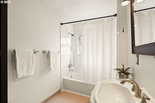 5125 NE Davis St, Portland, OR 97213 - bathroom with a sink, shower / bath combo, and baseboards