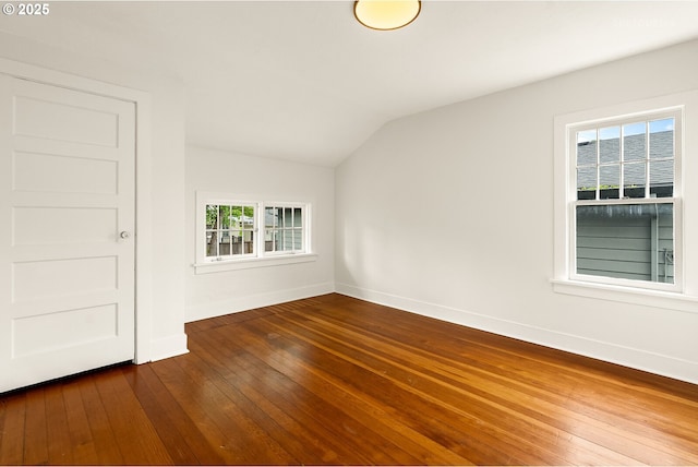 5125 NE Davis St, Portland, OR 97213 - spare room with lofted ceiling, baseboards, and dark wood-style flooring