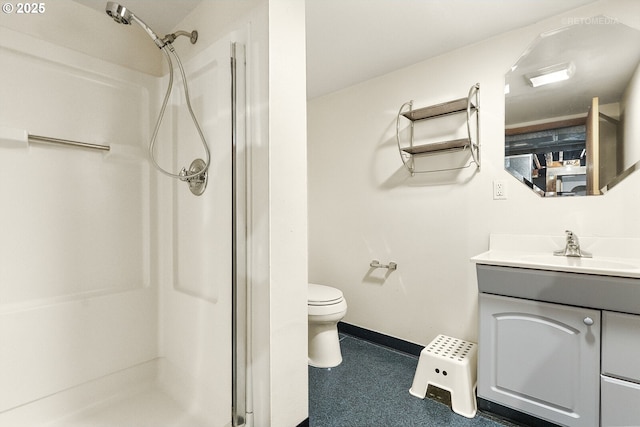 5125 NE Davis St, Portland, OR 97213 - bathroom featuring a shower stall, toilet, vanity, and baseboards