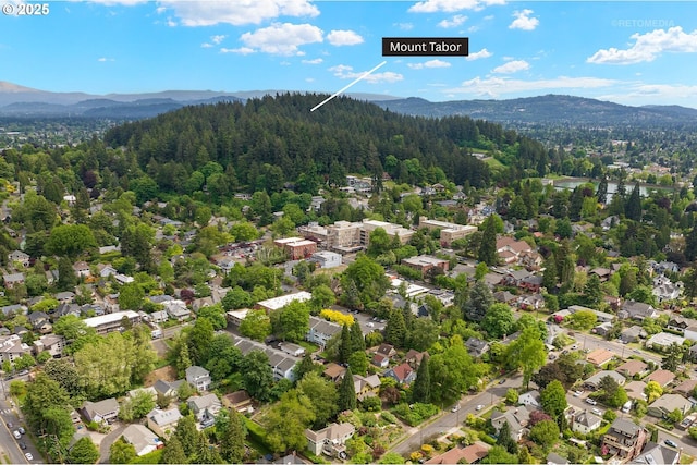 5125 NE Davis St, Portland, OR 97213 - view of property location with a mountain backdrop, a heavily wooded area, and nearby suburban area