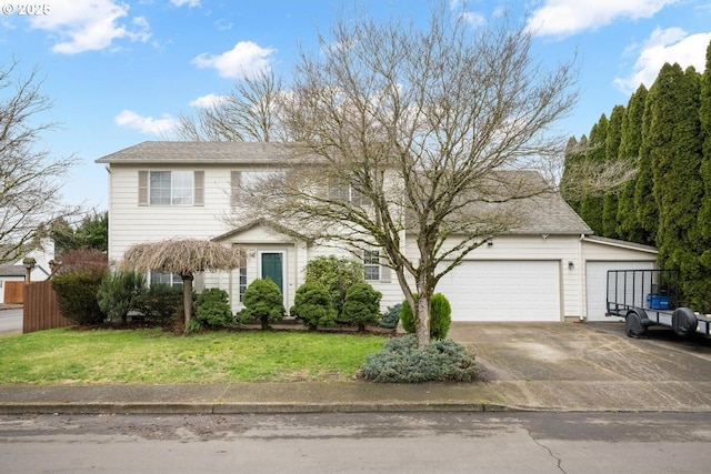 view of front of home featuring an attached garage, driveway, a front lawn, and fence