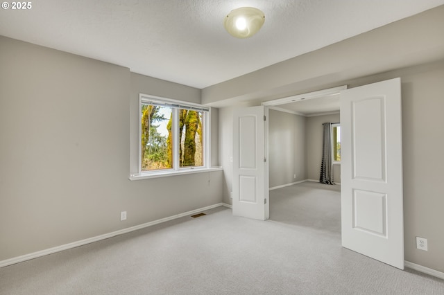1610 Lee St, Lake Oswego, OR 97034 - unfurnished bedroom with baseboards, carpet flooring, and multiple windows