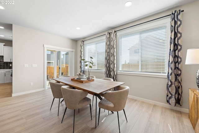 dining area with recessed lighting, baseboards, and light wood-style flooring