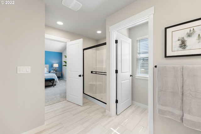 ensuite bathroom with visible vents, a shower stall, baseboards, connected bathroom, and recessed lighting