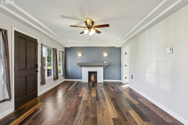 707 S 6th Ave, Kelso, WA 98626 - unfurnished living room with ceiling fan, baseboards, a lit fireplace, and wood finished floors