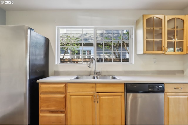707 S 6th Ave, Kelso, WA 98626 - kitchen featuring a wealth of natural light, a sink, glass insert cabinets, and appliances with stainless steel finishes
