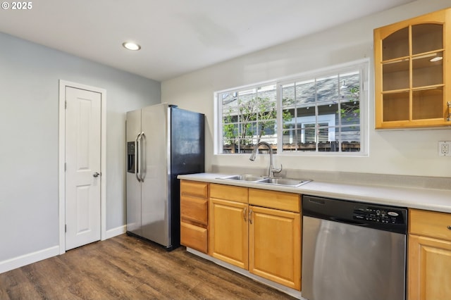 707 S 6th Ave, Kelso, WA 98626 - kitchen with stainless steel appliances, dark wood-style floors, a sink, glass insert cabinets, and light countertops