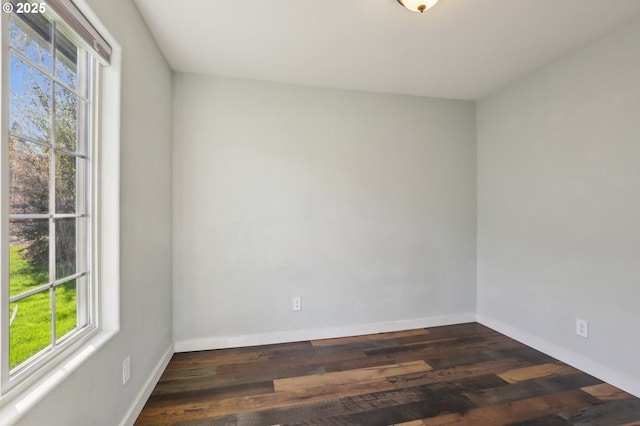 707 S 6th Ave, Kelso, WA 98626 - empty room with baseboards, a wealth of natural light, and dark wood finished floors