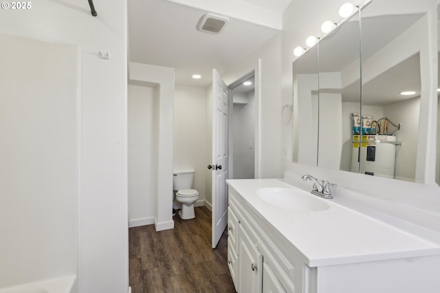 707 S 6th Ave, Kelso, WA 98626 - bathroom featuring wood finished floors, vanity, water heater, toilet, and visible vents