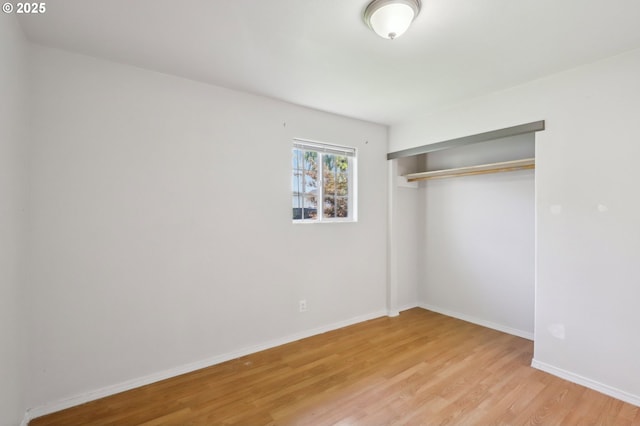 707 S 6th Ave, Kelso, WA 98626 - unfurnished bedroom with baseboards, a closet, and light wood-type flooring